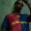 Travis Scott “merges universes” with FC Barcelona and Spotify for new shirt 